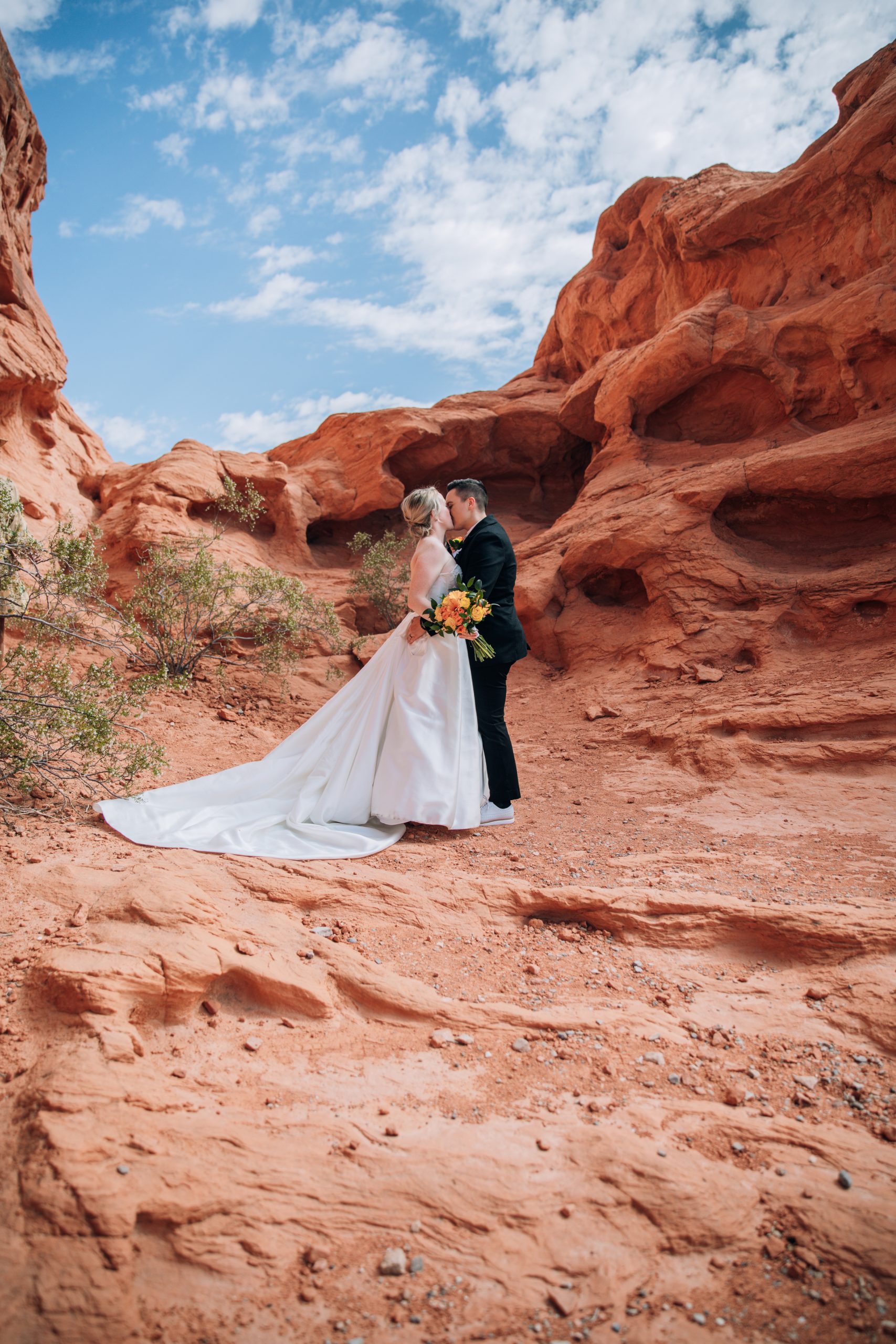 A couple exchanges a kiss after their elopement outside of Las Vegas, Nevada